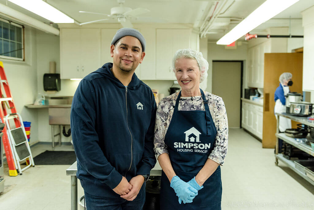 Img: A man and woman standing in a commercial kitchen