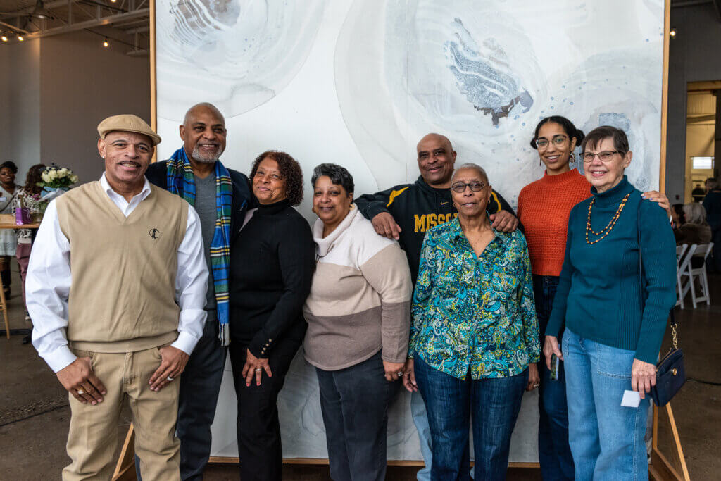 Eight family members pose for a photo